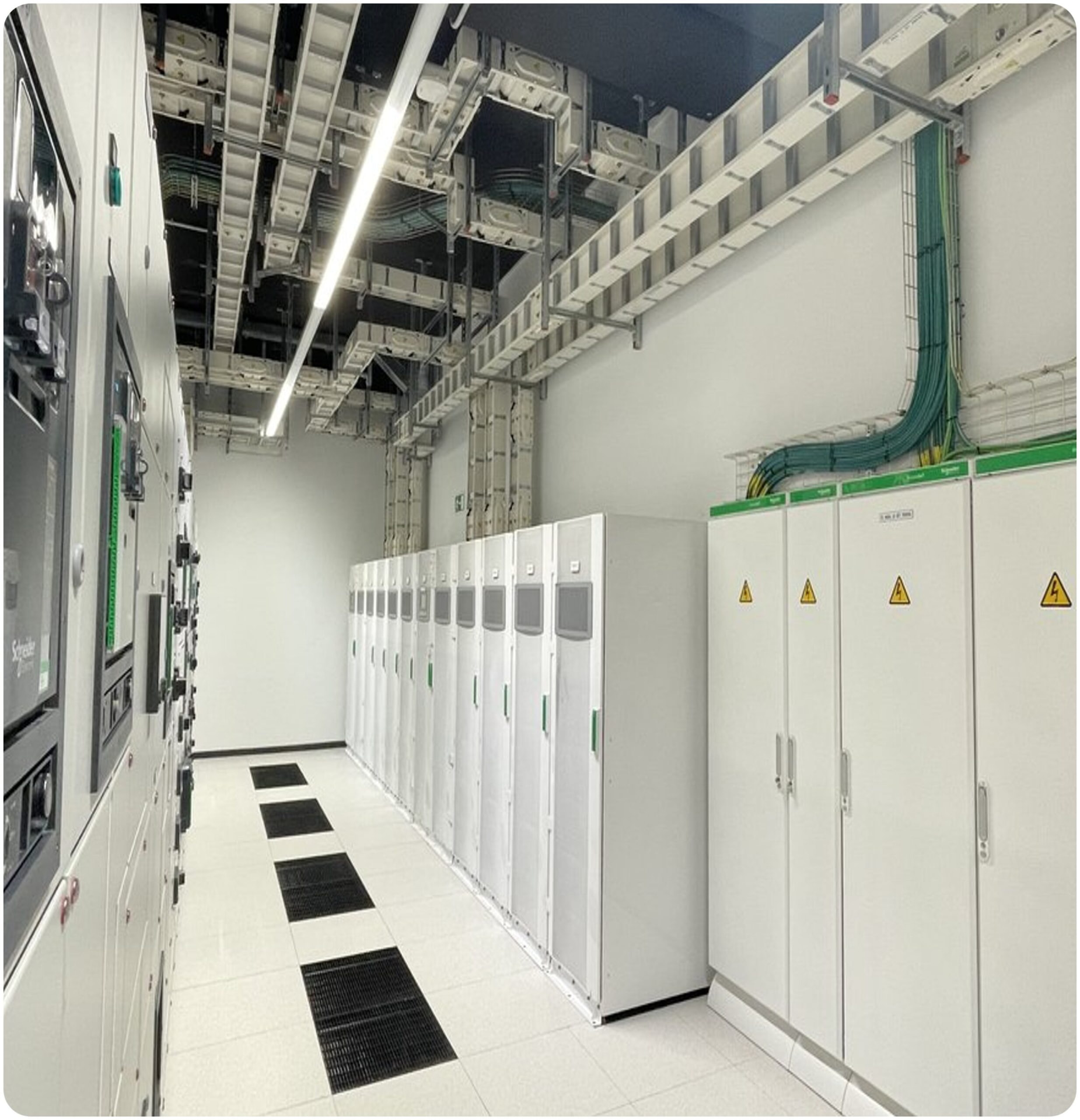 Data centre electrical room with switchgear cabinets, overhead containment and structured cabling